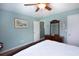 Inviting bedroom featuring a ceiling fan, soothing light-blue walls, and a dark-wood bed at 160 Syrr Run Rd, Saint George, SC 29477
