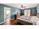 Comfortable bedroom with ceiling fan, hardwood floors, and access to ensuite bathroom at 160 Syrr Run Rd, Saint George, SC 29477
