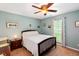 Comfortable bedroom with natural light, ceiling fan, and neutral carpeting, creating a cozy and inviting space at 160 Syrr Run Rd, Saint George, SC 29477