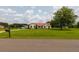 Charming single-story home with a red roof and an expansive green lawn at 160 Syrr Run Rd, Saint George, SC 29477