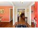 Inviting foyer with hardwood floors, neutral walls, and a view into the living room at 160 Syrr Run Rd, Saint George, SC 29477