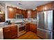 Traditional-style kitchen with wood cabinets, granite countertops, and stainless steel appliances at 160 Syrr Run Rd, Saint George, SC 29477