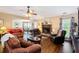 Open living area with brick fireplace and a view of the kitchen and dining space at 160 Syrr Run Rd, Saint George, SC 29477