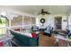 Cozy screened-in porch with comfortable seating, ceiling fan, and access to the outdoors at 160 Syrr Run Rd, Saint George, SC 29477