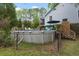 Exterior shot of backyard featuring above ground pool, patio space, and grassy area at 1604 Macoma Dr, Mount Pleasant, SC 29466