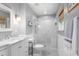 Bathroom features a glass-enclosed shower, white vanity with marble countertop, and wainscoting detail at 1604 Macoma Dr, Mount Pleasant, SC 29466