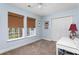This bedroom includes two windows, a closet, and desk space creating a cozy and functional atmosphere at 1604 Macoma Dr, Mount Pleasant, SC 29466