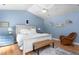 Charming bedroom with light blue walls, vaulted ceiling, a ceiling fan, and hardwood floors at 1604 Macoma Dr, Mount Pleasant, SC 29466