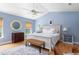 Bright bedroom features light blue walls, hardwood floors, a vaulted ceiling and a ceiling fan at 1604 Macoma Dr, Mount Pleasant, SC 29466