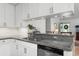 This kitchen features granite countertops, stainless steel appliances, subway tile backsplash, and opens to living area at 1604 Macoma Dr, Mount Pleasant, SC 29466