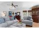 Comfortable living room with hardwood floors, a fireplace, large couches, and natural light at 1604 Macoma Dr, Mount Pleasant, SC 29466