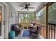 Screened in porch with outdoor seating offers peaceful wooded views and a relaxing space at 1604 Macoma Dr, Mount Pleasant, SC 29466