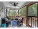 Cozy covered patio with stylish seating, a ceiling fan, and wooded views, creating an inviting outdoor space at 1604 Macoma Dr, Mount Pleasant, SC 29466
