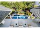 Aerial view featuring a pool and seating overlooking the lush landscaping, perfect for relaxation at 1635 Bull Creek Ln, Charleston, SC 29414