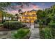 Gorgeous multi-story home with a pool, patio and tropical landscaping in a fenced backyard at 1635 Bull Creek Ln, Charleston, SC 29414