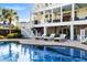 Inviting backyard featuring a sparkling pool and comfortable lounge chairs for relaxation and outdoor enjoyment at 1635 Bull Creek Ln, Charleston, SC 29414