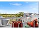 Cozy balcony with bright, comfortable seating, offering views of the neighborhood and lush greenery at 1635 Bull Creek Ln, Charleston, SC 29414