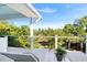 Scenic balcony view of the surrounding trees offering a peaceful retreat with comfortable lounge chairs at 1635 Bull Creek Ln, Charleston, SC 29414