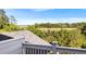 Expansive view from the balcony, showcasing lush greenery, a waterway and blue skies at 1635 Bull Creek Ln, Charleston, SC 29414