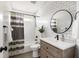 This bathroom features subway tile, a wood vanity, and modern fixtures for a clean, updated look at 1635 Bull Creek Ln, Charleston, SC 29414