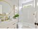 Stylish bathroom with modern fixtures, including a glass-enclosed shower and sleek vanity with gold hardware at 1635 Bull Creek Ln, Charleston, SC 29414