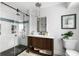 This bathroom features subway tile, a glass shower, and a dark wood vanity at 1635 Bull Creek Ln, Charleston, SC 29414