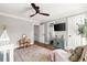 Bright Bedroom featuring daybed, white crib, wooden floors, a TV and door leading to a small balcony at 1635 Bull Creek Ln, Charleston, SC 29414
