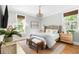 This bedroom features a chandelier, a woven rug, and large windows at 1635 Bull Creek Ln, Charleston, SC 29414