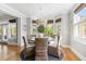 A breakfast nook is surrounded by natural light and a view of the outdoors at 1635 Bull Creek Ln, Charleston, SC 29414