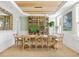 Bright dining room featuring a wooden table, stylish chairs, and a decorative cabinet for elegant dining at 1635 Bull Creek Ln, Charleston, SC 29414