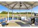Charming boat dock featuring a fish cleaning station, refrigerator, and stunning water views at 1635 Bull Creek Ln, Charleston, SC 29414