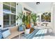 Charming front porch decorated with plants and a bench, creating a welcoming entrance to the home at 1635 Bull Creek Ln, Charleston, SC 29414