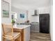 Stylish kitchen featuring gray cabinets, a breakfast bar, and stainless steel appliances at 1635 Bull Creek Ln, Charleston, SC 29414