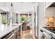 Bright modern kitchen with stainless steel appliances, an island, and an adjacent breakfast nook at 1635 Bull Creek Ln, Charleston, SC 29414