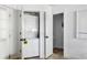 White laundry room with a stacked washer and dryer unit inside of an open closet at 1635 Bull Creek Ln, Charleston, SC 29414