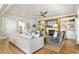 Inviting living room featuring a white sofa, fireplace, hardwood floors, and stylish decor for relaxed living at 1635 Bull Creek Ln, Charleston, SC 29414