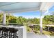 Outdoor bar with seating overlooking the lush trees and greenery, perfect for entertaining at 1635 Bull Creek Ln, Charleston, SC 29414