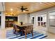 Covered outdoor dining area with a ceiling fan, bar, and access to the backyard at 1635 Bull Creek Ln, Charleston, SC 29414
