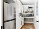 A tidy butler's pantry offers shelving, counter space and stainless appliances at 1635 Bull Creek Ln, Charleston, SC 29414