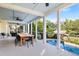 Covered patio with pool view features an outdoor dining area with fire feature at 1635 Bull Creek Ln, Charleston, SC 29414