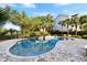 Beautiful pool with palm trees and blue skies creating a lovely backyard retreat at 1635 Bull Creek Ln, Charleston, SC 29414