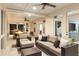 Inviting covered porch featuring comfortable seating, ceiling fans, and views of the surrounding landscape at 1635 Bull Creek Ln, Charleston, SC 29414