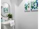 Elegant powder room with modern fixtures, a decorative mirror, and tasteful decor at 1635 Bull Creek Ln, Charleston, SC 29414