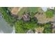 A bird's eye view shows a home with mature landscaping, trees and marsh views at 1648 Secessionville Rd, Charleston, SC 29412