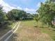 An aerial view shows a long driveway and a house surrounded by mature trees at 1648 Secessionville Rd, Charleston, SC 29412