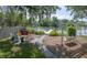 Inviting outdoor space with patio, fireplace, and swing, perfect for relaxation and entertaining at 1648 Secessionville Rd, Charleston, SC 29412