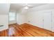 Bright bedroom featuring hardwood floors, a ceiling fan, and a window at 1648 Secessionville Rd, Charleston, SC 29412
