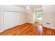 Bright bedroom featuring hardwood floors, a ceiling fan, a double closet, and natural light at 1648 Secessionville Rd, Charleston, SC 29412