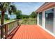 Spacious deck overlooking a lush backyard with mature trees and a glimpse of the neighbor's house at 1648 Secessionville Rd, Charleston, SC 29412