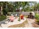 Firepit area with multiple chairs, oven, and river view at 1648 Secessionville Rd, Charleston, SC 29412